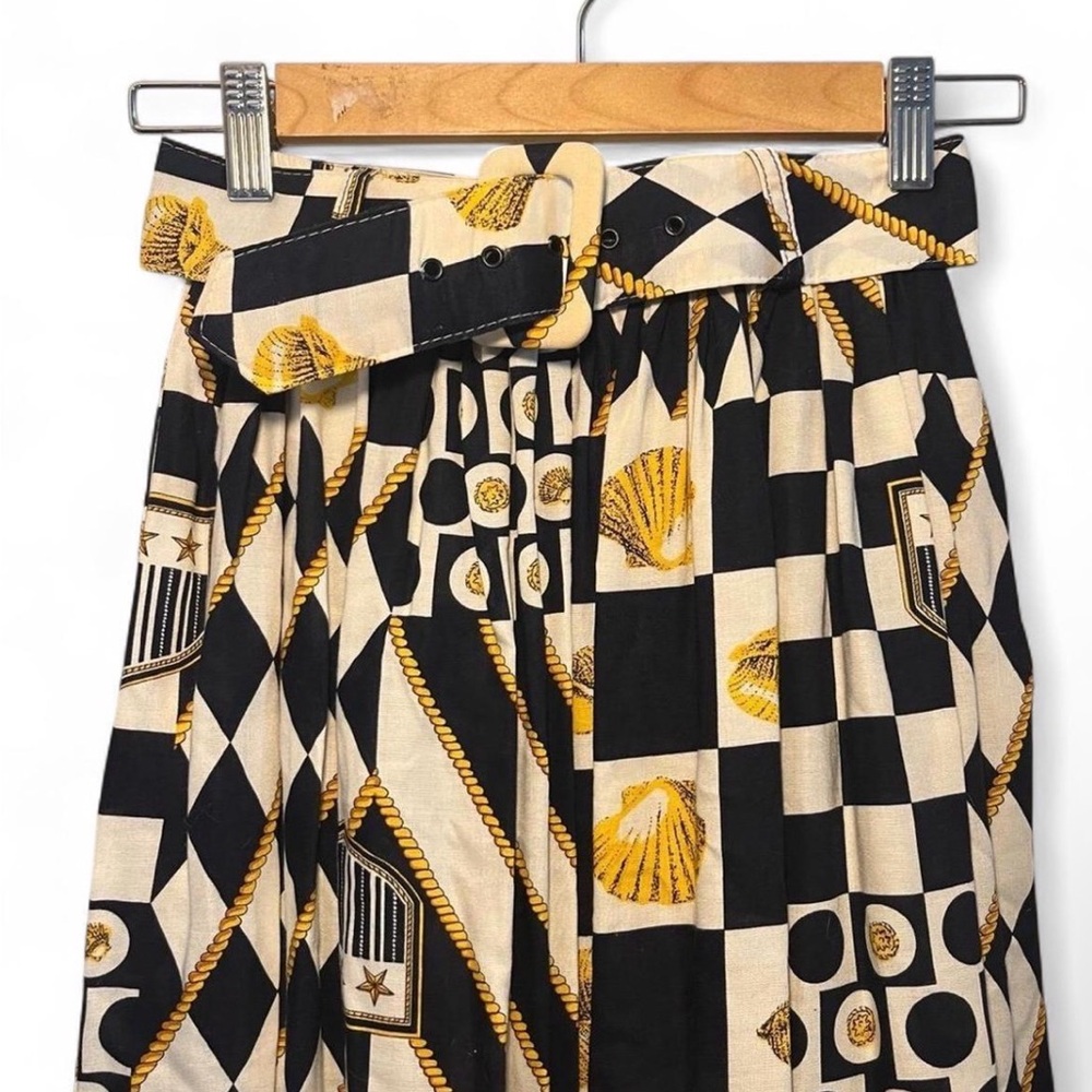 High-Waist Black & Cream Printed Pleated Skirt with Gold Accents